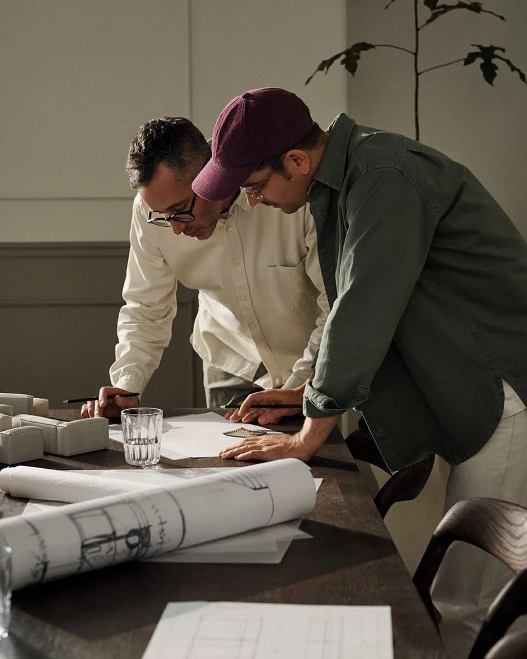 Design review with drawings, plans and material samples