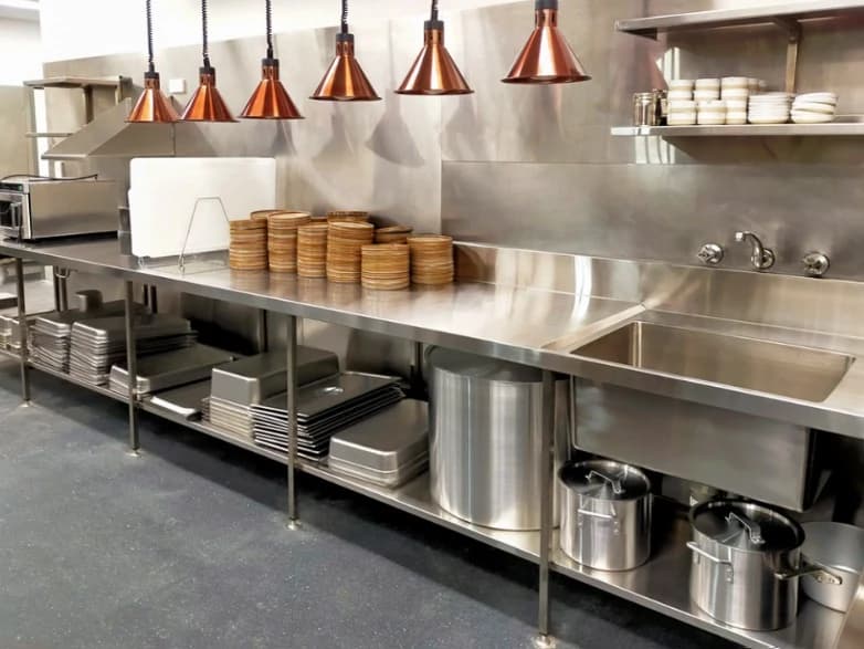 Kelvora recent kitchen installation with stainless steel counters and heat lamps