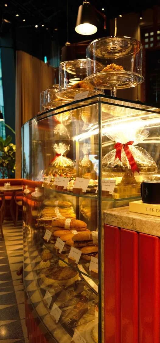 Food display counter with a glass canopy