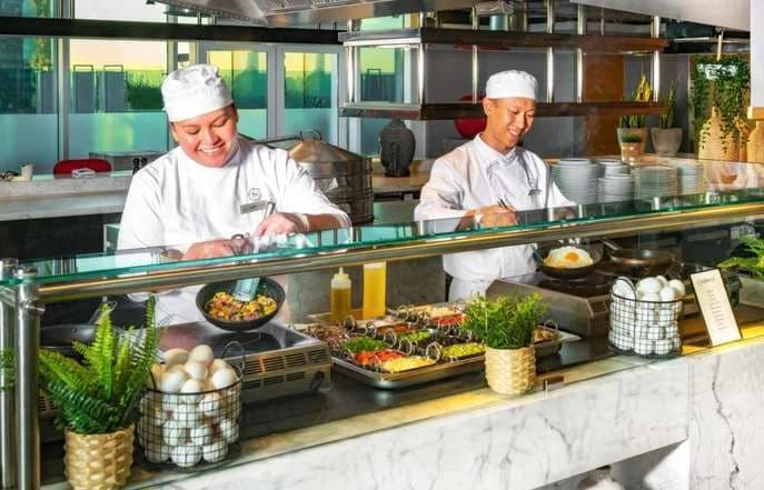 Chefs at a buffet service area
